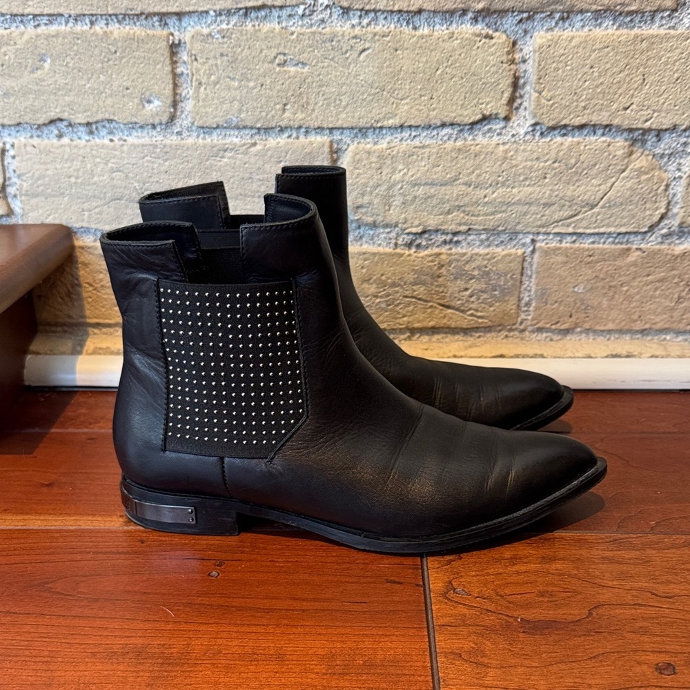 Victim Black Leather Ankle Boots with Metal Detailing